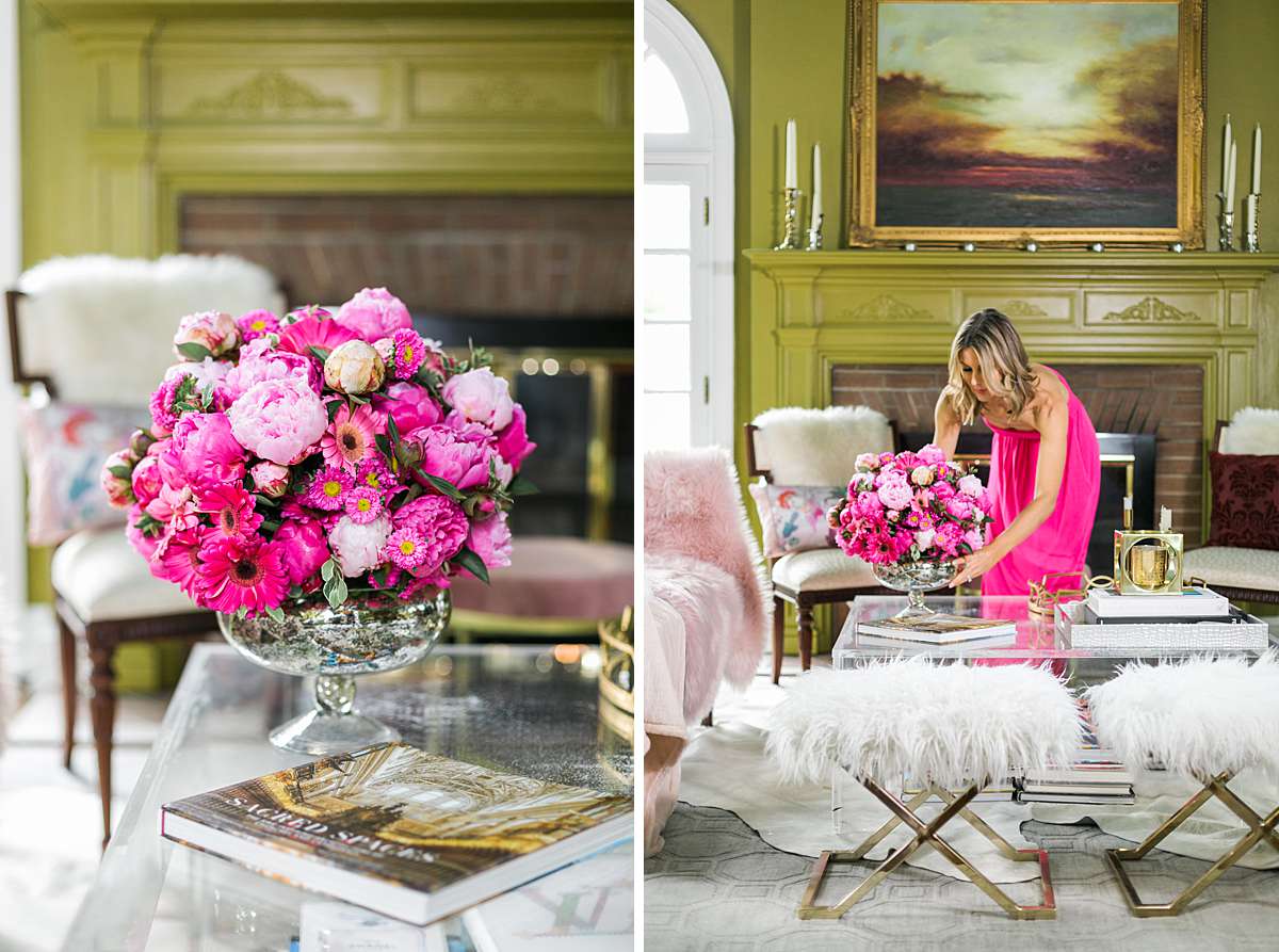 woman arranging bright pink flowers
