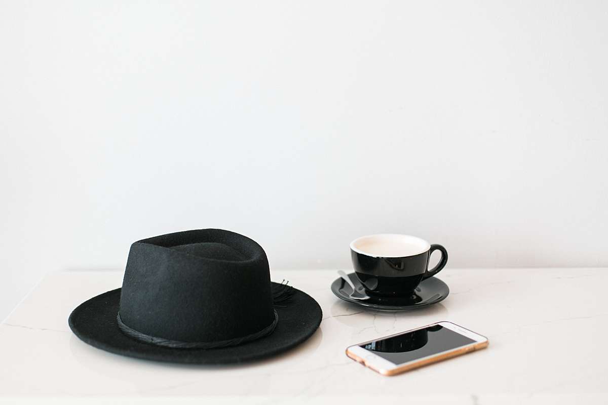 millenial image with coffee, hat and iphone