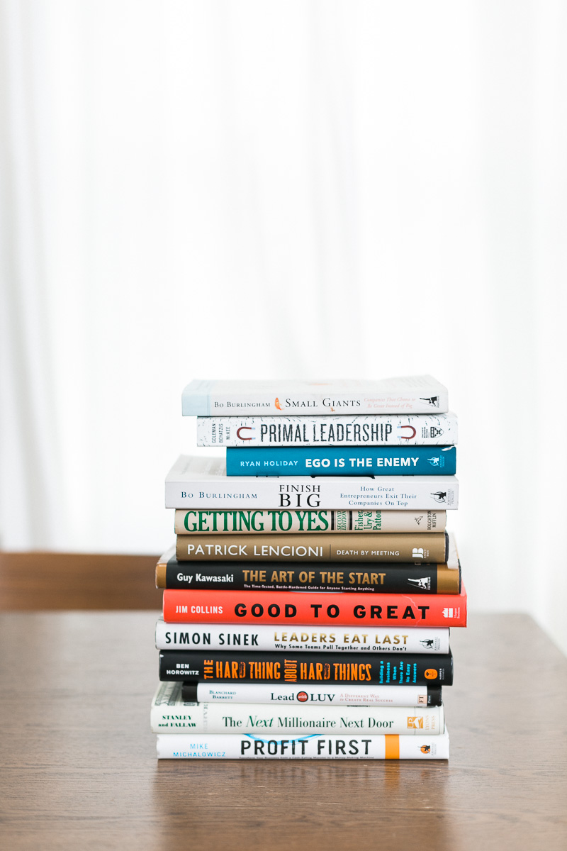 stack of business development books, affinity accounting, woman-owned business milwaukee wisconsin, photo by mybrandphotographer