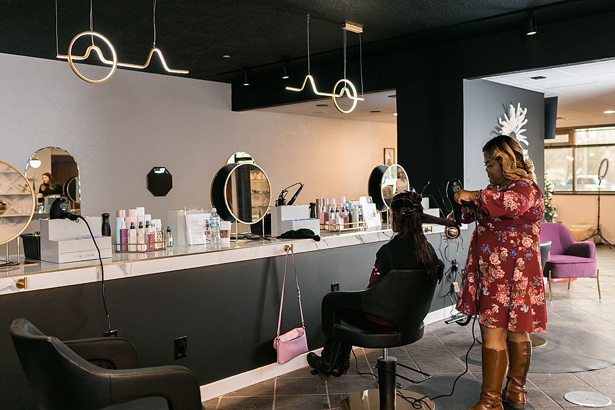 woman at salon getting hair styled