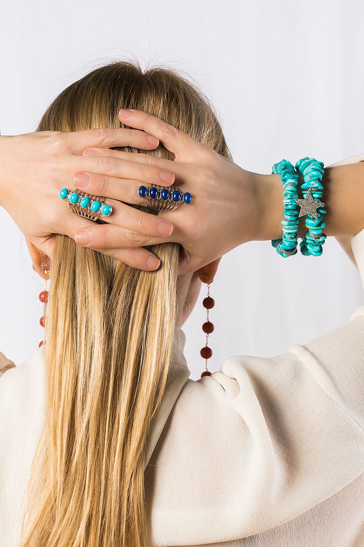 woman wearing turquoise bracelets, laura foote designs a milwaukee jewelry designer