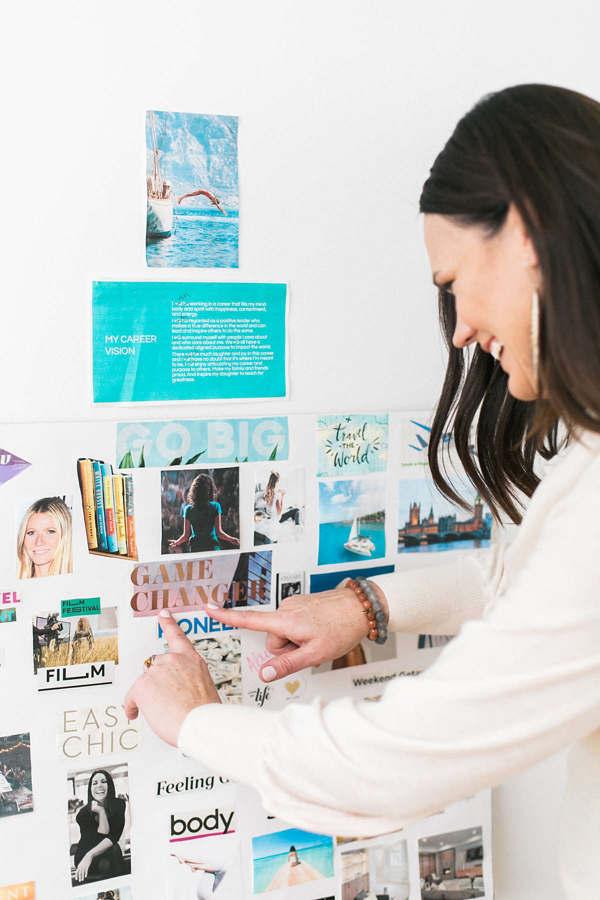 woman creating a vision board with tropical vibe