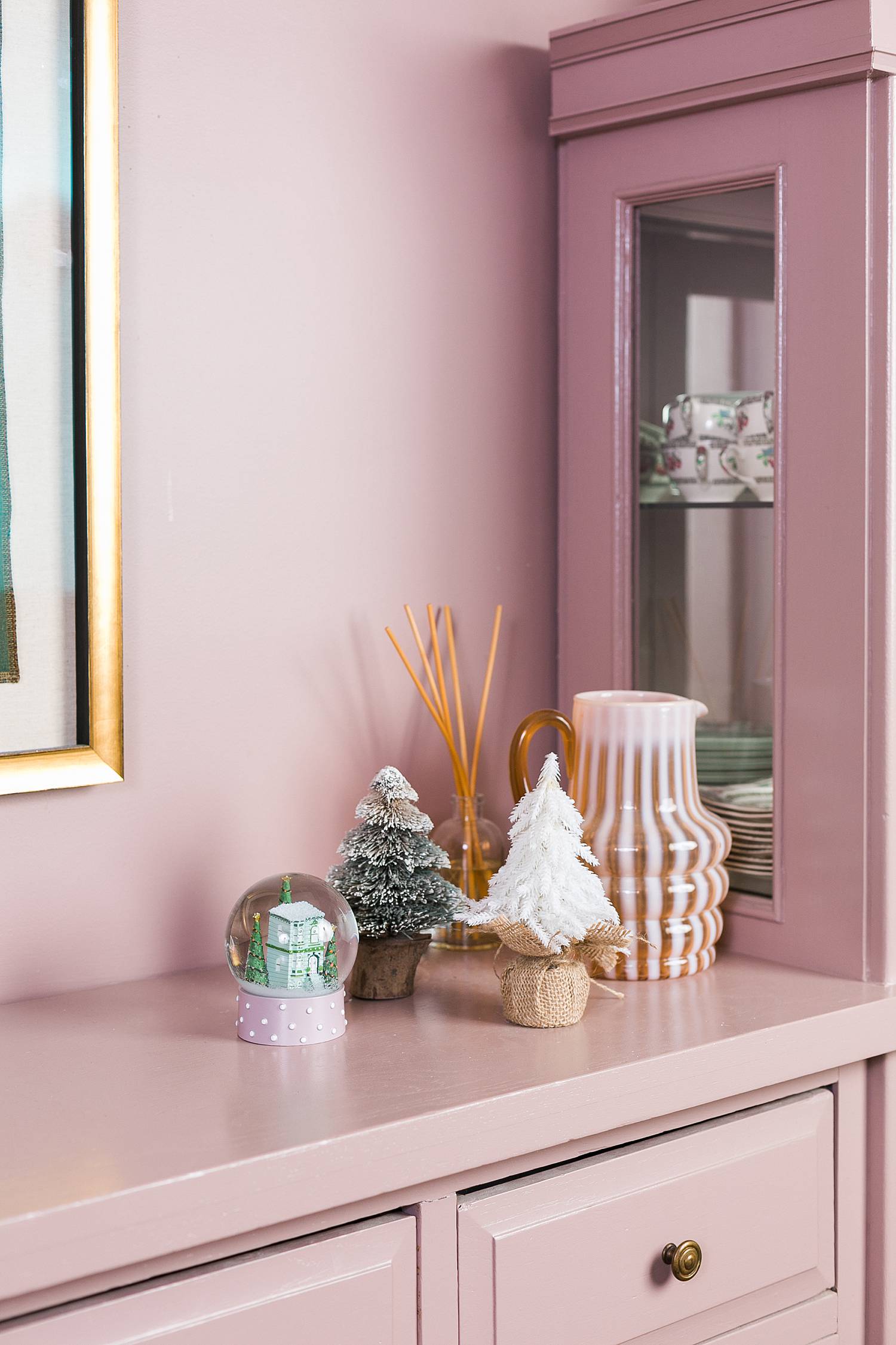 pink dining room hutch with holiday decor for real estate agents