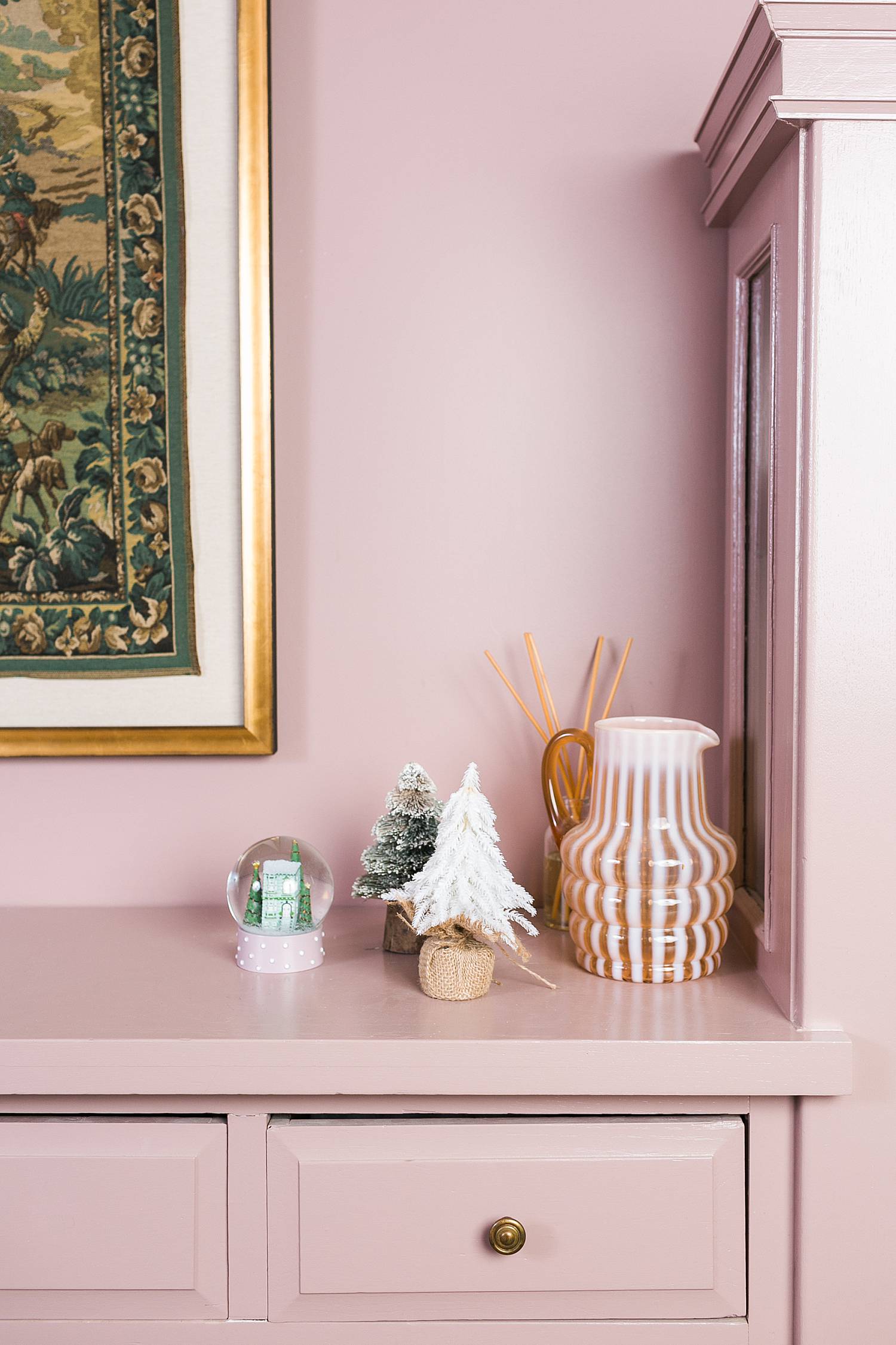 pink dining room hutch with holiday decor for real estate agents