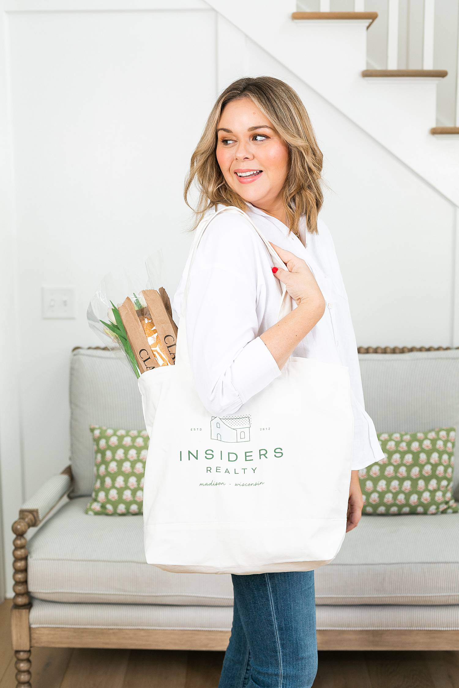 woman carrying farmers market bag custom branded for insiders realty in madison, wi