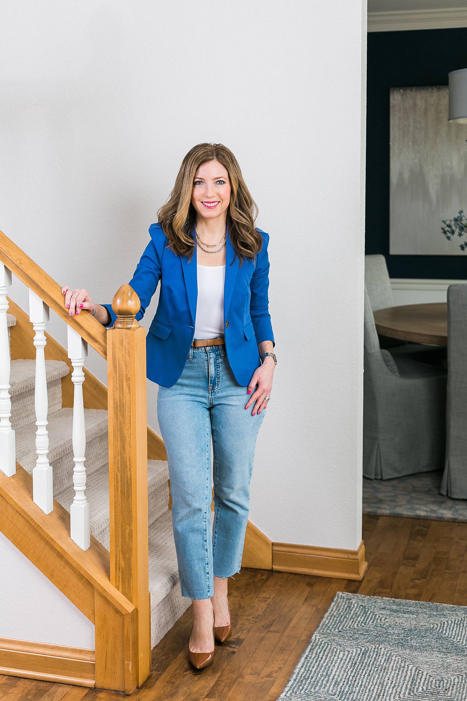 woman headshot for image consultant wearing a bright blue blazer and denim jeans