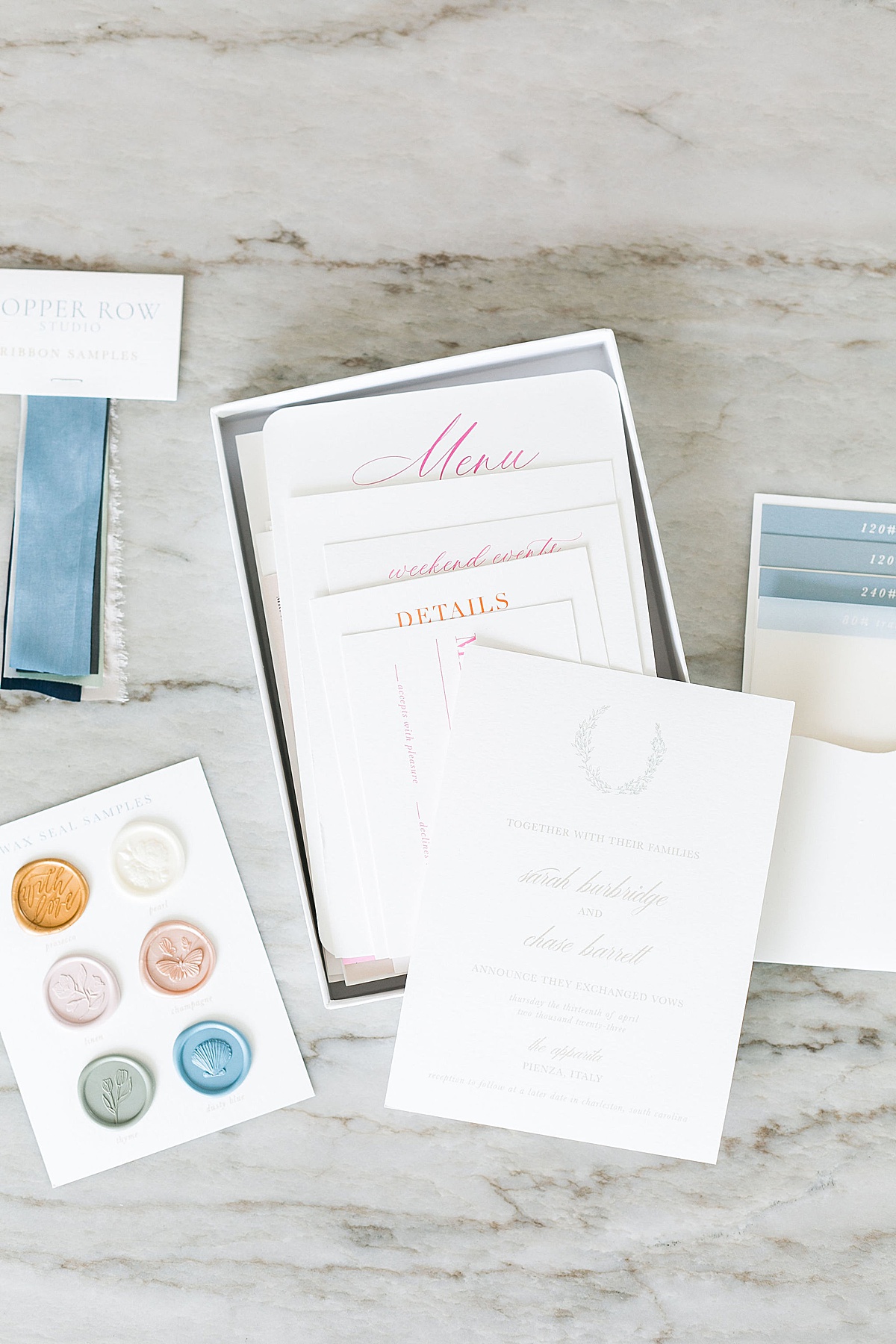 custom luxury wedding invitation sample kit on marble granite countertop