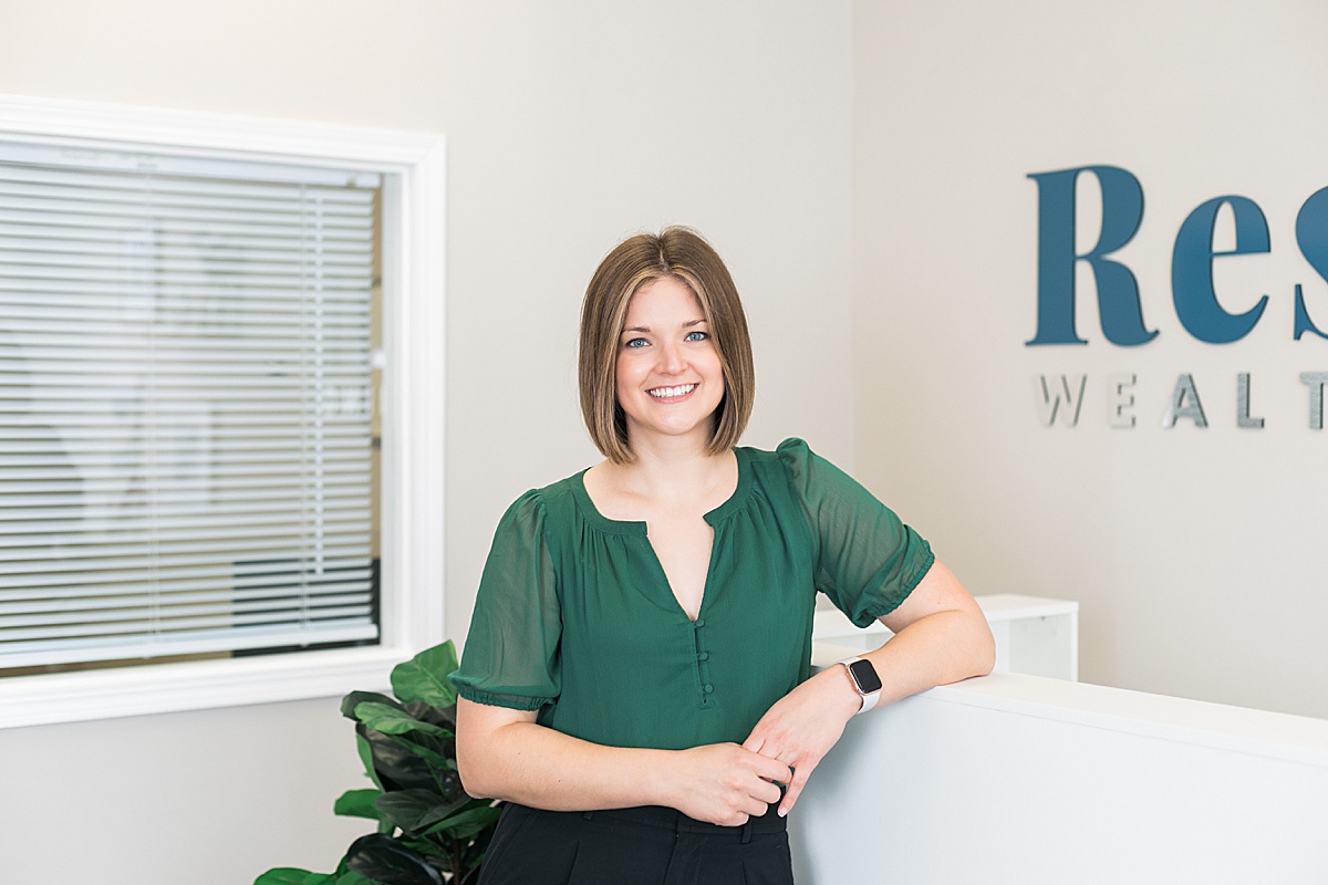 financial advisor headshot in green top shirt