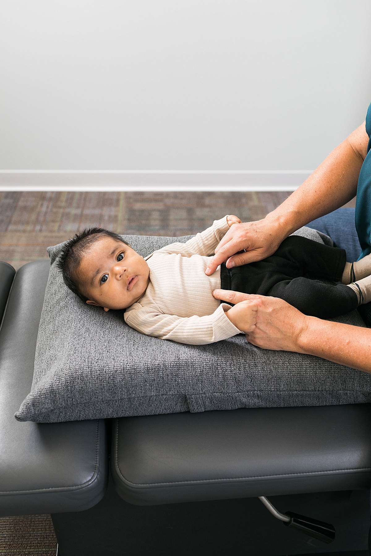 baby boy getting chiropractic care at mccann chiropractic in brookfield wi