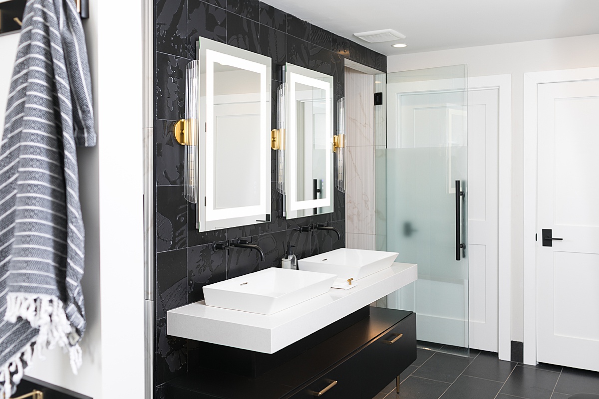 pool house bathroom with black and white color theme, sink and vanity